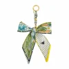 Blue Moon Studio™ Yellow & Multicolor Leaf Print Bow Bag Charm