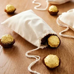 Cream Favor Muslin Bags by Celebrate Itâ„¢, 12ct.
