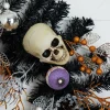 6ft. Artificial Halloween Black Garland with Skulls, Eyeballs & Spiders