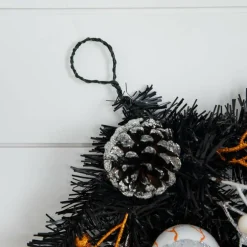 6ft. Artificial Halloween Black Garland with Skulls, Eyeballs & Spiders