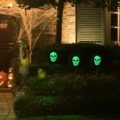 Glitzhome® 24" Halloween Metal Sunflower Skulls Glow-in-Dark Yard Stakes, 3ct.