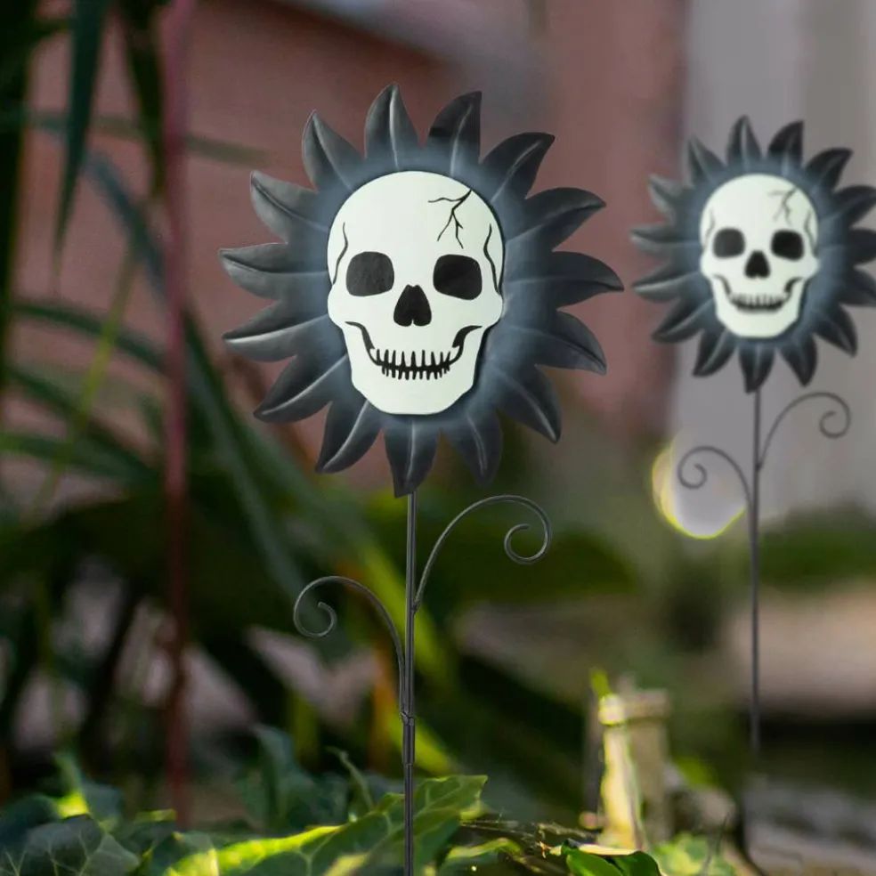 Glitzhome® 24" Halloween Metal Sunflower Skulls Glow-in-Dark Yard Stakes, 3ct.