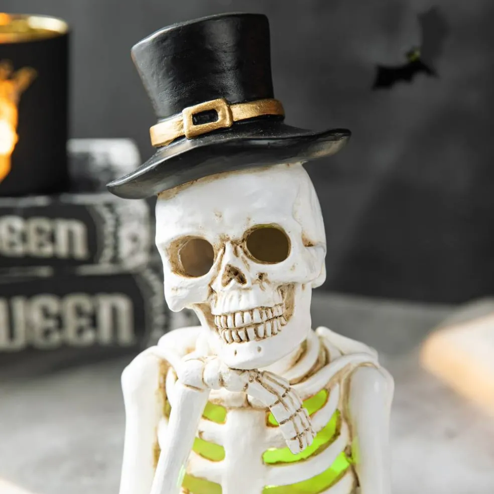 Glitzhome® 10" Lighted Halloween Resin Skull Reading Book Table Décor
