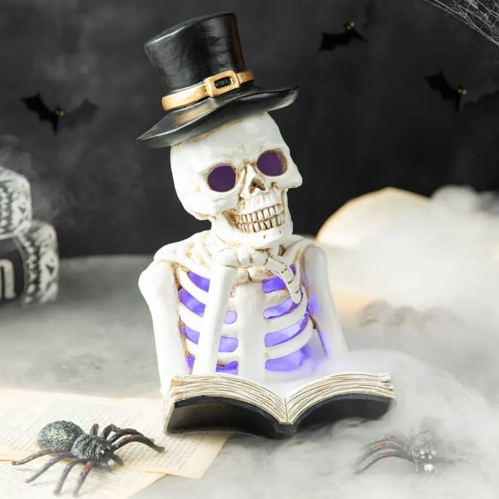 Glitzhome® 10" Lighted Halloween Resin Skull Reading Book Table Décor