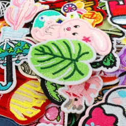 Iron on Patches for Clothing: 100Pcs Random Assorted Styles Funny Patch Repair Embroidered Appliques for Clothes Sew on/Iron on Jackets Backpacks Hat Dress Fabric for DIY Accessories