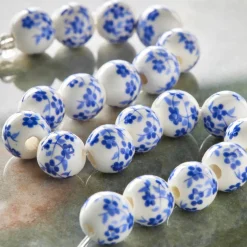 12 Pack: Blue Daisy Ceramic Round Beads, 8mm by Bead Landing™