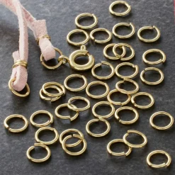 12 Pack: Gold Finish Jump Rings by Bead Landing™