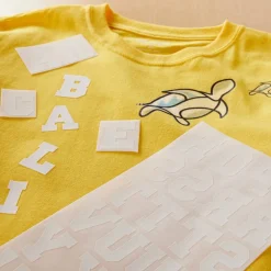 12 Pack: Iron-On White Flocked Athletic Letters by Imagin8™
