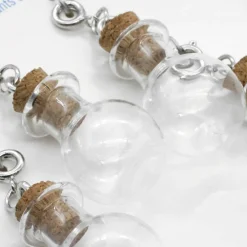 12 Packs: 4 ct. (48 total) Clear Potion Bottle Charms by Creatology™
