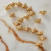 12 Packs: 18 ct. (216 total) Gold Metal Star Beads, 11mm by Bead Landing™