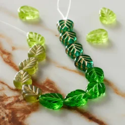 6 Packs: 16 ct. (96 total) Green Czech Glass Leaf Beads, 10.5mm by Bead Landing™