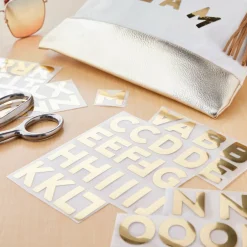 12 Packs: 62 ct. (744 total) Iron-On Gold Foil Block Alphabet by Make Market®